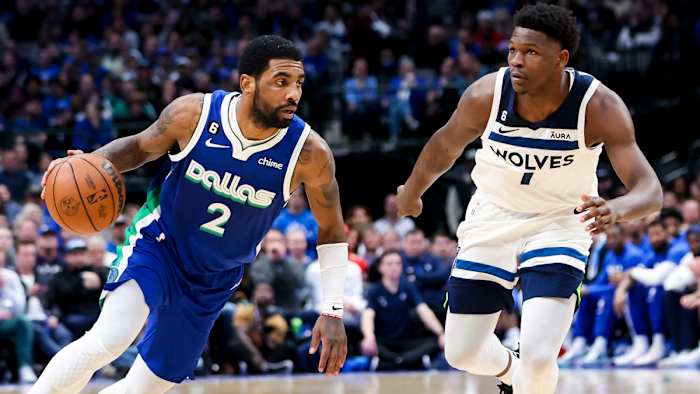 Kyrie Irving drives past Anthony Edwards